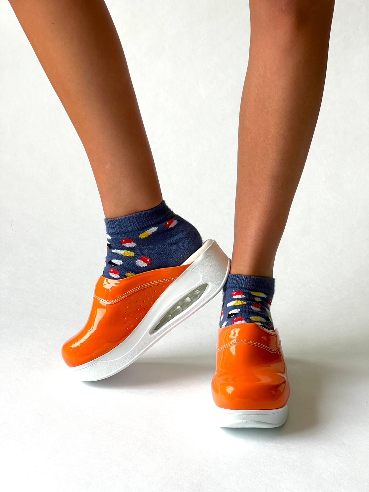 Airmeds solid orange lacquer clogs