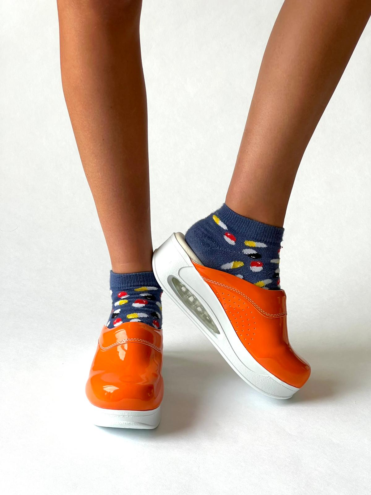 Airmeds solid orange lacquer clogs